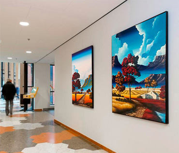 A Nicky van Rensburg painting of a colourful landscape