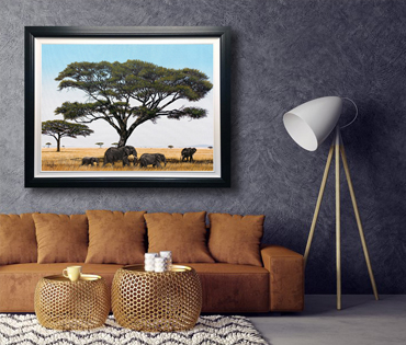 A Nicky van Rensburg painting of elephants gracing under acacia trees